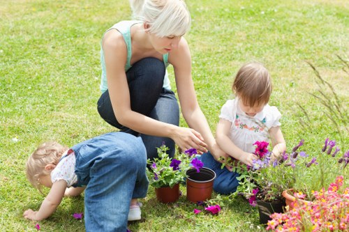 Professional planting and soil preparation for a flower bed in Teddington